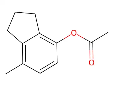 7-methyl-2,3-dihydro-1H-inden-4-yl acetate structure